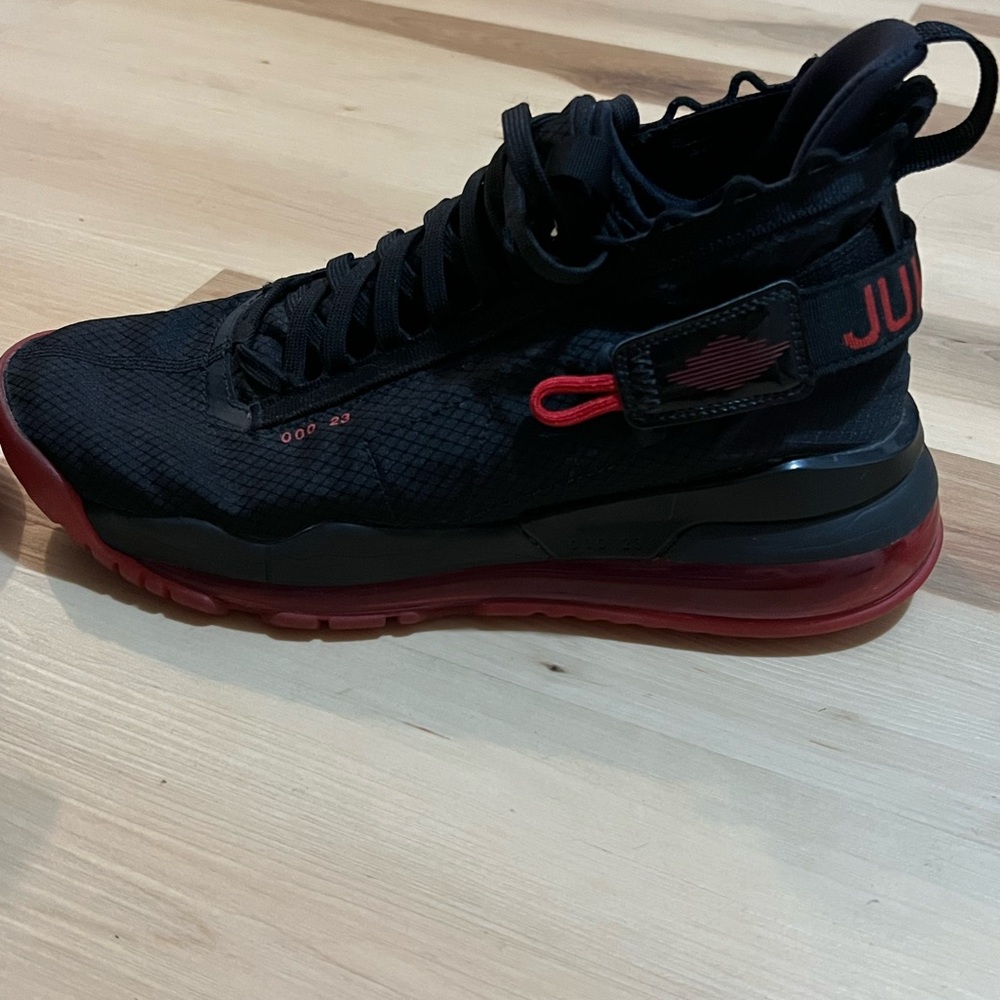 The Air Jordan Proto Max 720 Black University Red.